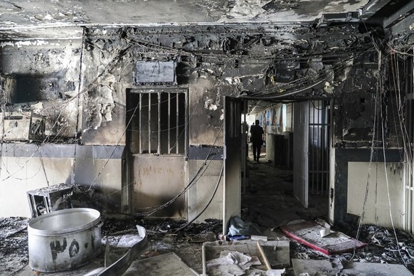 This photo released by Mizan News Agency, shows a workshop of Evin prison following a fire in Tehran, Iran, Sunday, Oct. 16, 2022. A towering blaze at the prison housing political prisoners and anti-g ...
