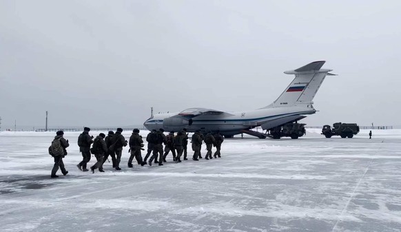 220107 -- MOSCOW, Jan. 7, 2022 -- Screenshot taken on Jan. 6, 2022 shows soldiers boarding a military transport aircraft at the Chkalovsky airfield on the outskirts of Moscow, Russia. The Russian Aero ...