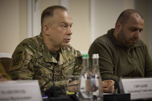 May 16, 2024, Kharkiv, Kharkiv Region, Ukraine: Ukrainian Commander-in-Chief Oleksandr Syrskyi, left, briefs President Volodymyr Zelenskyy during a meeting with the Staff of the Supreme Commander-in-C ...