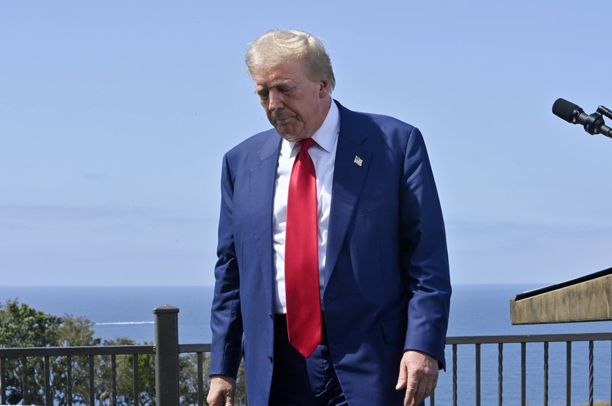 Former president and Republican presidential nominee Donald J. Trump departs after making remarks to the press at Trump National Golf Club with the Pacific Ocean in the background in Los Angeles on Fr ...