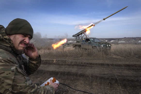 A Ukrainian officer from The 56th Separate Motorized Infantry Mariupol Brigade fires a multiple launch rocket system based on a pickup truck towards Russian positions at the front line, near Bakhmut,  ...