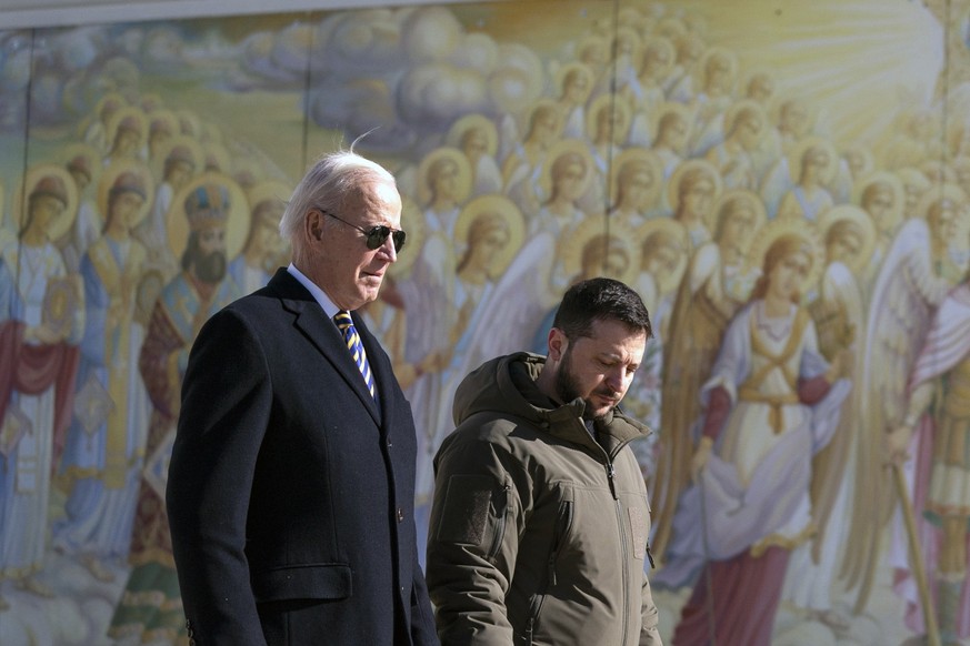 US President Joe Biden, left, walks with Ukrainian President Volodymyr Zelenskyy at St. Michaels Golden-Domed Cathedral during an unannounced visit, in Kyiv, Ukraine, Monday, Feb. 20, 2023. (AP Photo/ ...