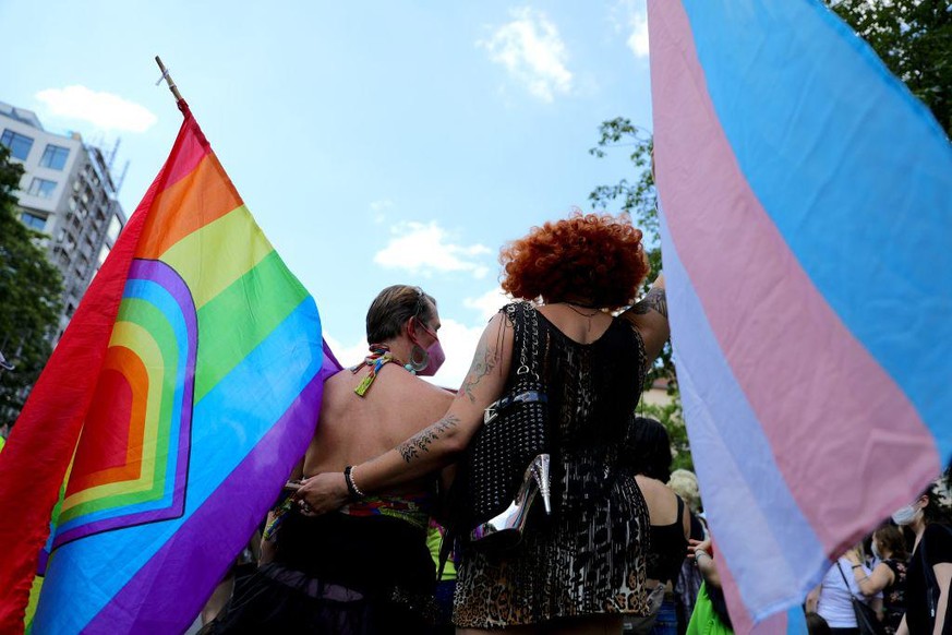 BERLIN, GERMANY - JUNE 26: Participants in the Queerschutz Now! (Queer Protection Now!) embrace each other as they march in commemoration and celebration of Christopher Street Day on June 26, 2021 in  ...