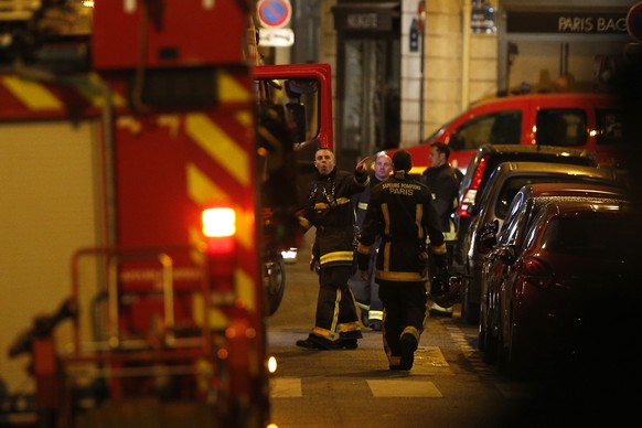 Rescue workers park in the area after a knife attack in central Paris, Saturday May 12, 2018. The Paris police said the attacker was subdued by officers during the stabbing attack in the 2nd arrondiss ...