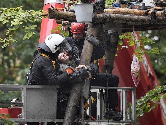 Police removes activists from treehouses in the forest 'Hambacher Forst' near Dueren, Germany, Thursday, Sept. 13, 2018. Young environmentalists fight against German energy company RWE, who ...