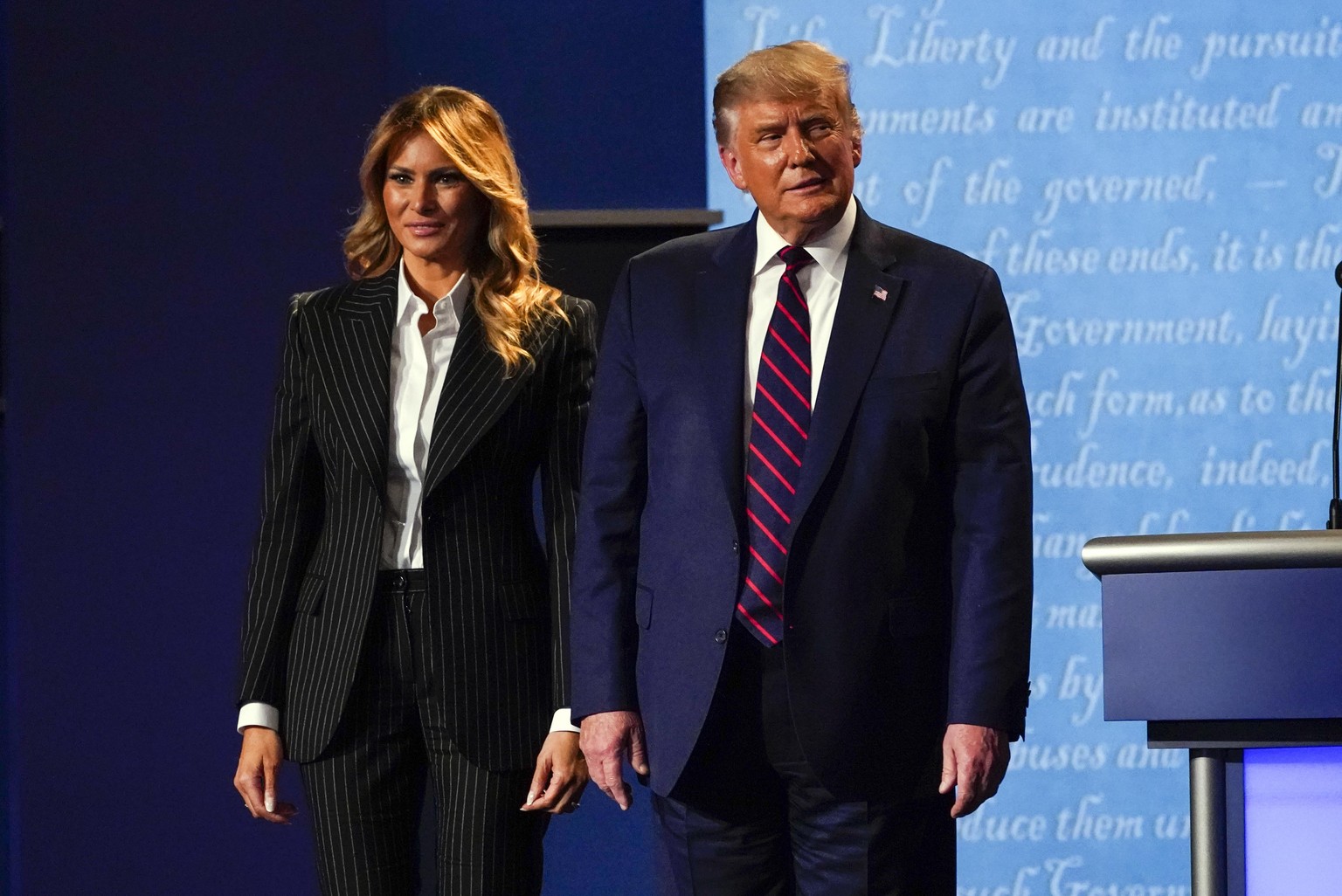 President Donald Trump stands on stage with first lady Melania Trump after the first presidential debate with Democratic presidential candidate former Vice President Joe Biden Tuesday, Sept. 29, 2020, ...