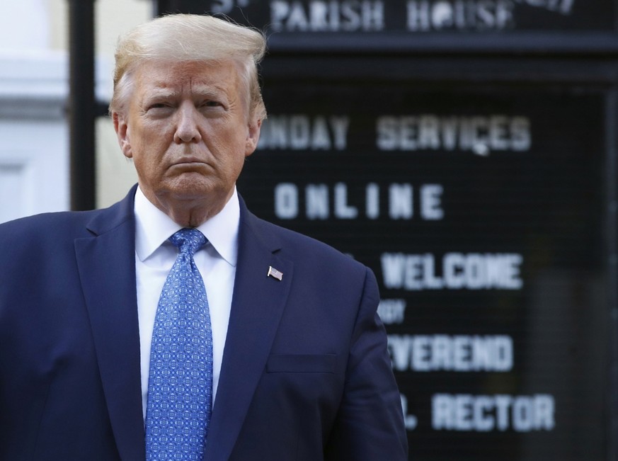 FILE - President Donald Trump holds a Bible as he visits outside St. John&#039;s Church, June 1, 2020, in Washington. (AP Photo/Patrick Semansky, File)