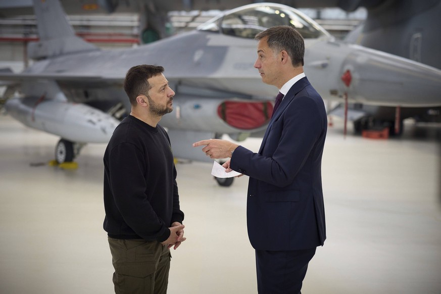 May 28, 2024, Steenokkerzeel, Belgium: Ukrainian President Volodymyr Zelenskyy, left, speaks with Belgian Prime Minister Alexander De Croo, right, in front of a F-16 fighter aircraft at Melsbroek Air  ...