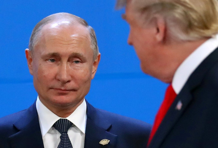 FILE PHOTO: Russia&#039;s President Vladimir Putin and U.S. President Donald Trump are seen during the G20 summit in Buenos Aires, Argentina November 30, 2018. REUTERS/Marcos Brindicci/File Photo/File ...