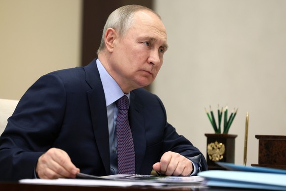 Russian President Vladimir Putin listens to Ivanovo Region Governor Stanislav Voskresensky during their meeting at the Novo-Ogaryovo state residence, outside Moscow, Russia, Wednesday, May 10, 2023. ( ...