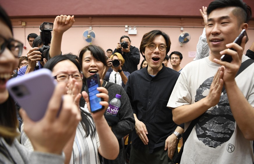 Hong Kong district council elections Supporters react in Hong Kong on Nov. 25, 2019, as a pro-democracy candidate looks certain to win a seat in district council elections. PUBLICATIONxINxGERxSUIxAUTx ...