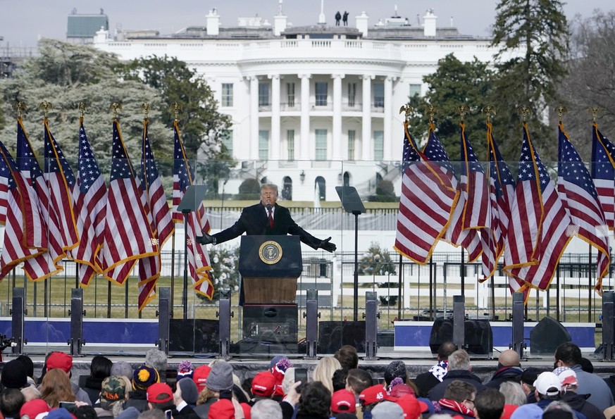 FILE - With the White House in the background, President Donald Trump speaks at a rally in Washington, Jan. 6, 2021. A judge on Monday, Aug. 28, 2023, set a March 4, 2024, trial date for Donald Trump  ...