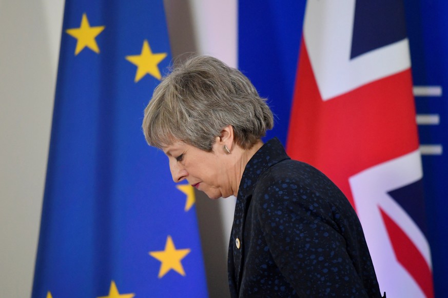 FILE PHOTO: Britain's Prime Minister Theresa May leaves after giving a news briefing in Brussels, Belgium, March 22, 2019. REUTERS/Toby Melville/File Photo