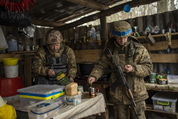 FILE - Soldiers of Ukraine&#039;s state border guard have a break for tea at a military position in the Sumy region of Ukraine, Friday, Nov. 24, 2023. After blunting Ukraine&#039;s counteroffensive fr ...