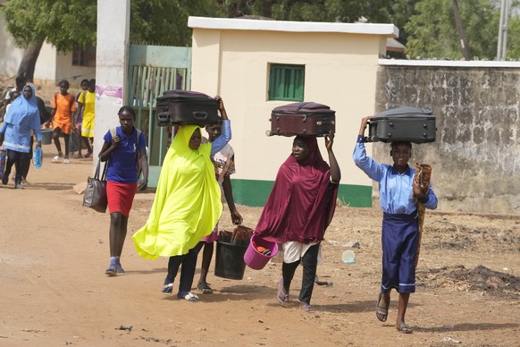 Students of government girls secondary school Yola, leaves for vacation following the closures of schools by government before the elections in Yola, Nigeria Thursday, Feb. 23, 2023. On Feb. 25, voter ...