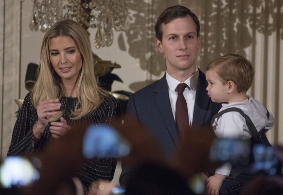 Trumps Host Chanukah Reception Ivanka Trump listens and Jared Kushner holds their son Theodore as United States President Donald J. Trump makes remarks as the President and first lady Melania Trump ho ...