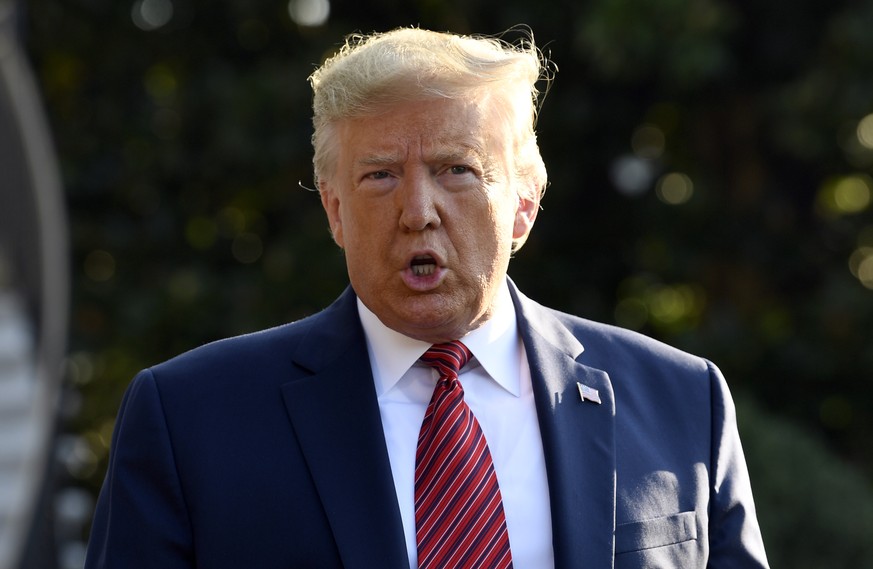 President Donald Trump talks with reporters before leaving on Marine One on the South Lawn of the White House in Washington, Sunday, Sept. 22, 2019. Trump is traveling to Texas and Ohio before heading ...