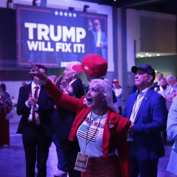 Supporters react as they watch election results at an election night campaign watch party for Republican presidential nominee former President Donald Trump Tuesday, Nov. 5, 2024, in West Palm Beach, F ...