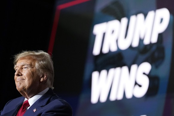 Republican presidential candidate former President Donald Trump speaks at a caucus night party in Des Moines, Iowa, Monday, Jan. 15, 2024. (AP Photo/Andrew Harnik)