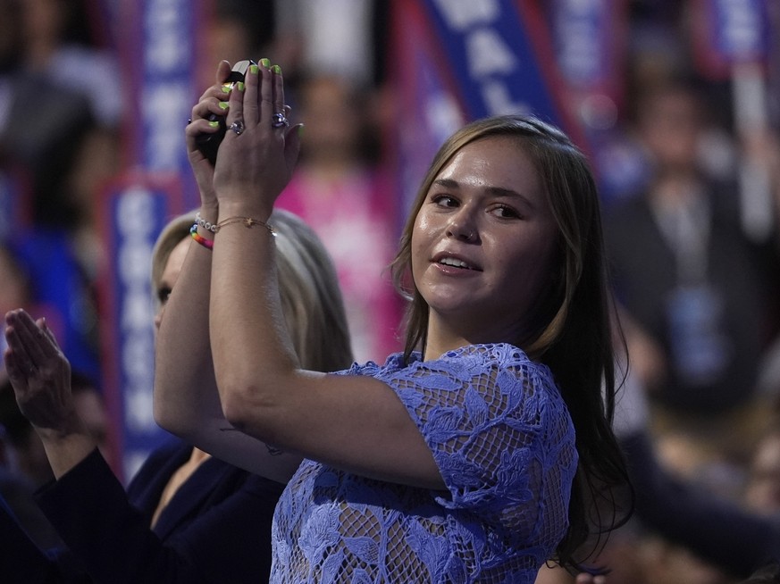 Hope Walz, daughter of Democratic vice presidential nominee Minnesota Gov. Tim Walz, cheers during the Democratic National Convention Wednesday, Aug. 21, 2024, in Chicago. (AP Photo/Erin Hooley)