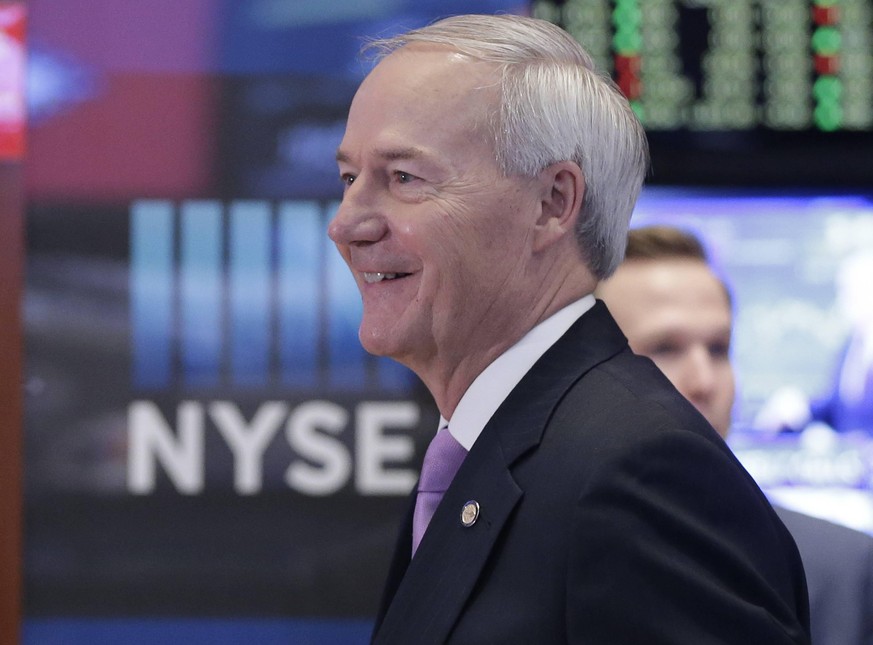 Governor of Arkansas Gov Asa Hutchinson stands on the floor of the NYSE at the opening bell at the New York Stock Exchange on Wall Street in New York City on January 11, 2016. U.S. oil prices dropped  ...