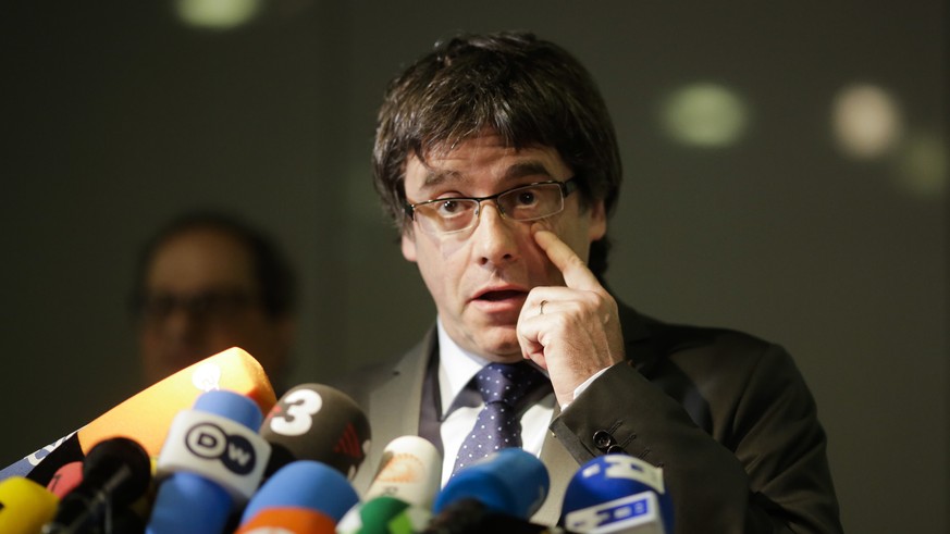 Former Catalan leader, Carles Puigdemont, addresses the media during a news conference in Berlin, Germany, Tuesday, May 15, 2018. (AP Photo/Markus Schreiber)