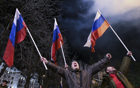 DONETSK, DONETSK PEOPLE'S REPUBLIC - FEBRUARY 22, 2022: Donetsk residents celebrate recognition of independence of the Donetsk and Lugansk People's Republics by Russia. Russian President Putin signed  ...