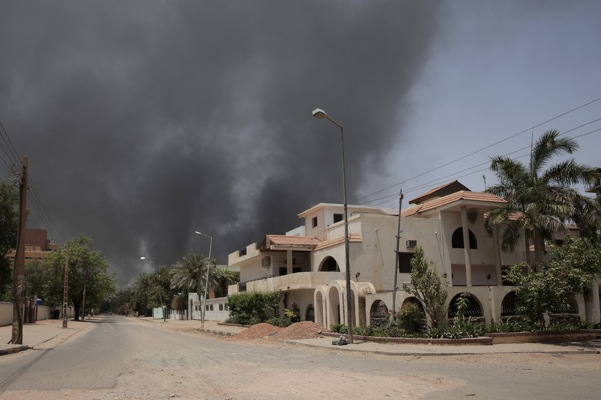 Smoke is seen rising from a neighborhood in Khartoum, Sudan, Saturday, April 15, 2023. Fierce clashes between Sudan’s military and the country’s powerful paramilitary erupted in the capital and elsewh ...