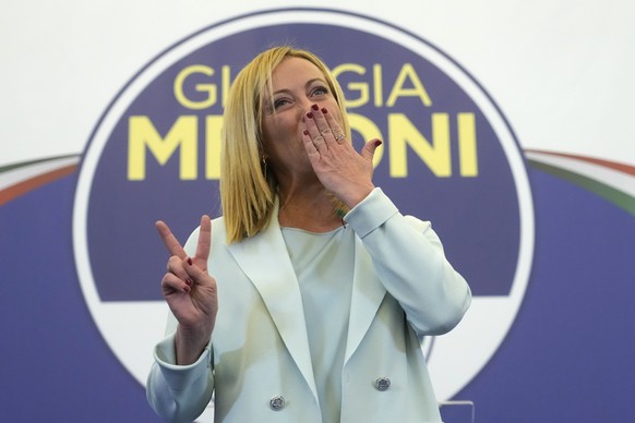 Far-Right party Brothers of Italy's leader Giorgia Meloni flashes the victory sign at her party's electoral headquarters in Rome, early Monday, Sept. 26, 2022. Italian voters rewarded Giorgia Meloni's ...