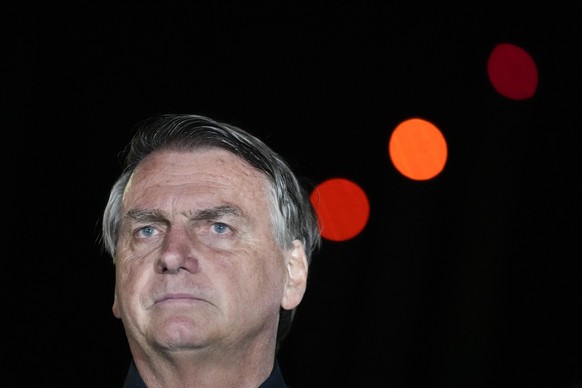 Brazilian President Jair Bolsonaro, who is running for another term, gestures during a press conference after general election polls closed in in Brasilia, Brazil, Sunday, Oct. 2, 2022. (AP Photo/Eral ...