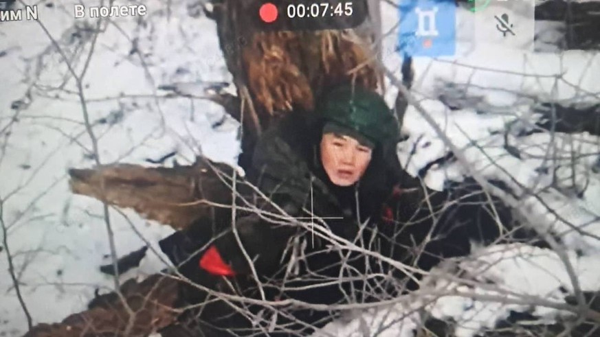 RECORD DATE NOT STATED 266228.jpg Image published by Ukraine President Volodymyr Zelenskyy on Dec 17, 2024 shows a number of men taking cover behind trees, saying they were North Korean troops who had ...