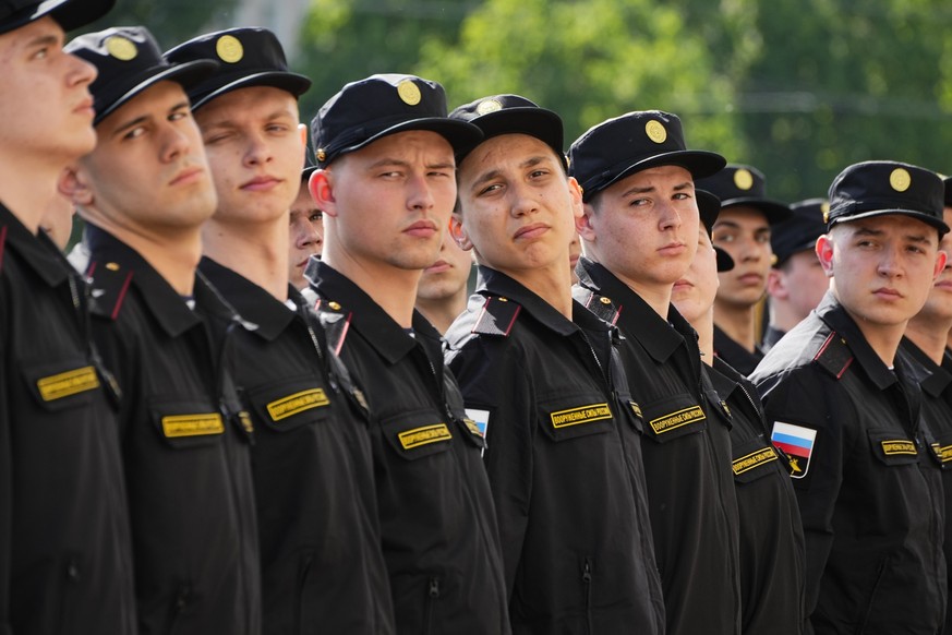 Russian conscripts stand in line during a send-off event before they head to assigned military units for mandatory one-year military service in St. Petersburg, Russia, Tuesday, May 23, 2023. Russian P ...