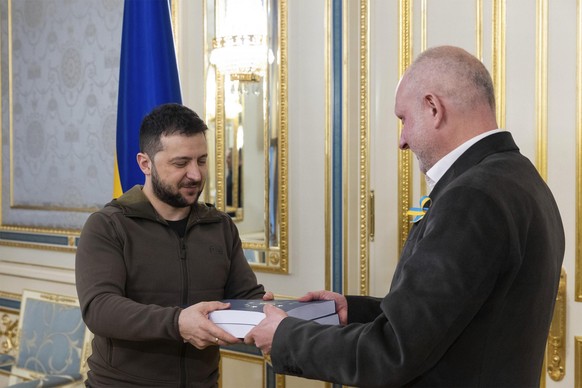 April 18, 2022, Kyiv, Kyiv, Ukraine: Ukrainian President Volodymyr Zelenskyy, left, greets Head of the Delegation of the European Union to Ukraine Matti Maasikas to hand over the completed questionnai ...