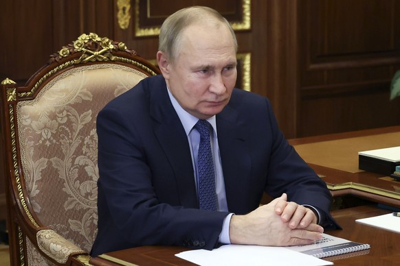 Russian President Vladimir Putin listens to Moscow Region Governor Andrei Vorobyev in Moscow, Russia, Monday, April 3, 2023. (Mikhail Klimentyev, Sputnik, Kremlin Pool Photo via AP)
