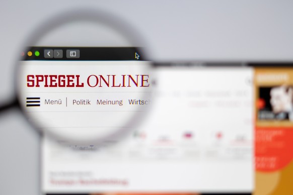 New York, USA - March 26, 2019: Germany news media Spiegel Online website homepage. Spiegel Online logo visible through a magnifying glass. xkwx activity, background, brand, business, company, compute ...