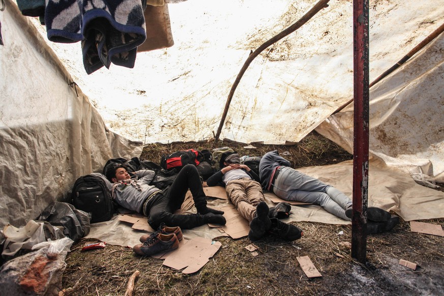 Refugees wait in front of the Greek border at Pazarkule gate, in Edirne, Turkey, 3 March 2020. Turkey will no longer stop Syrian irregular migrants from reaching Europe, a senior Turkish official said ...