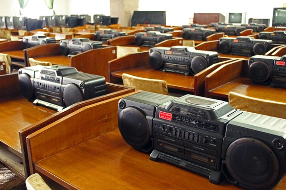 Pyongyang, North Korea - August 15, 2013: Rows of stereo systems are available in the music library at the Grand People&#039;s Study Hall. A massive collection of music from all over the world is avai ...