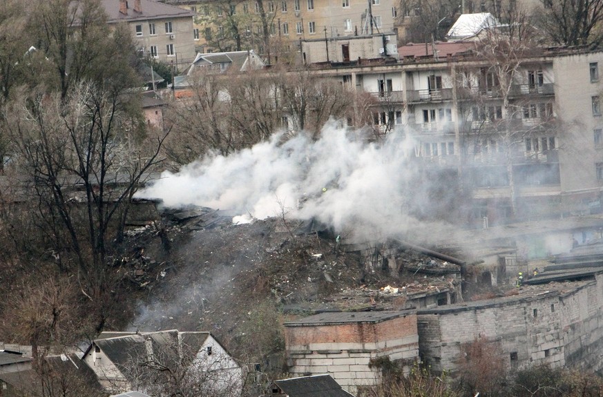 DNIPRO, UKRAINE - NOVEMBER 21, 2024 - A pillar of smoke rises over a garage cooperative damaged by the Russian missile strike, Dnipro, east-central Ukraine. On Thursday morning, November 21, Russians  ...