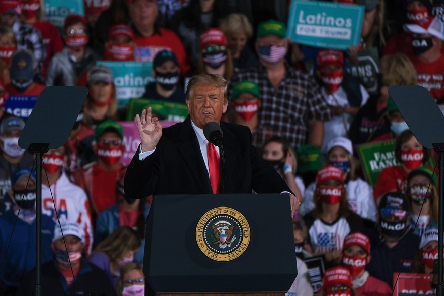 October 14, 2020, Des Moines, Iowa, U.S: US President DONALD TRUMP gestures as he speaks with supporters during a campaign stop in Des Moines, Iowa on October 14, 2020. The rally is Trump s third of 4 ...