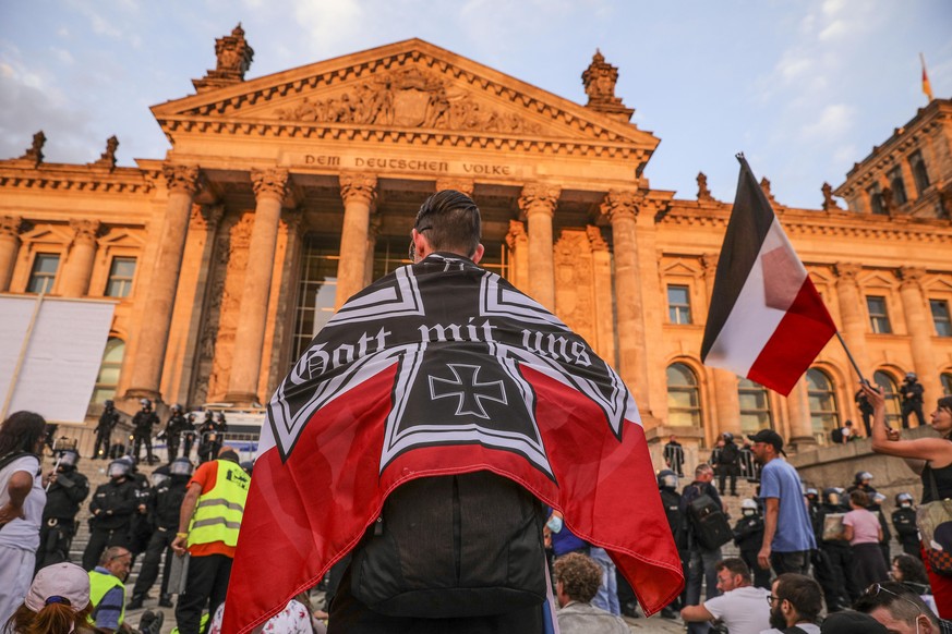 BERLIN, GERMANY - AUGUST 29: Coronavirus skeptics and right-wing extremists seen outside the Reichstag building as they march in protest against coronavirus-related restrictions and government policy  ...