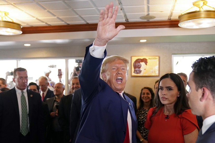 Former President Donald Trump waves to supporters at Versailles restaurant on Tuesday, June 13, 2023, in Miami. Trump appeared in federal court Tuesday on dozens of felony charges accusing him of ille ...
