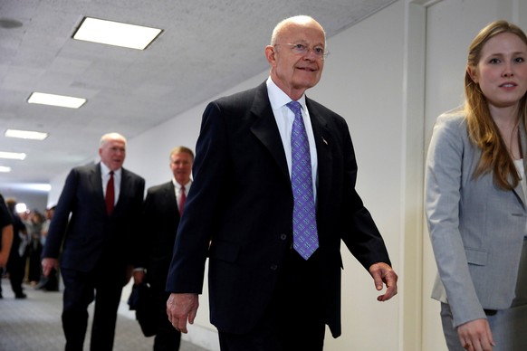 FILE PHOTO: Former Director of National Intelligence (DNI) James Clapper departs from a Senate Intelligence Committee hearing evaluating the Intelligence Community Assessment on &quot;Russian Activiti ...