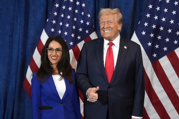 Republican presidential nominee former President Donald Trump poses for a photo with Rep. Lauren Boebert, R-Colo., before he speaks at a campaign rally at the Gaylord Rockies Resort &amp; Convention C ...