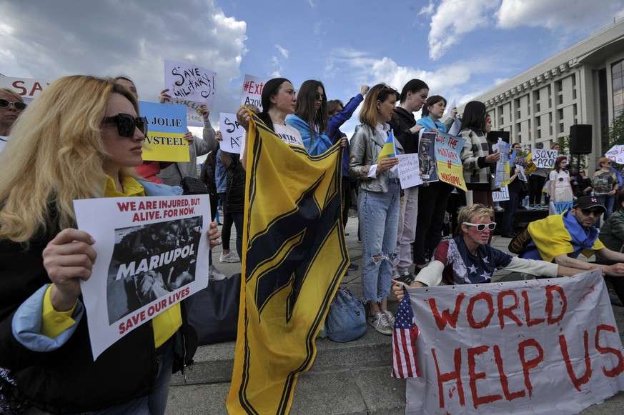 May 3, 2022, Kyiv, Ukraine: Activists and relatives of the defenders of Mariupol, hold placards expressing their opinion as they take part in the action Let s save the defenders of Mariupol in Kyiv. U ...