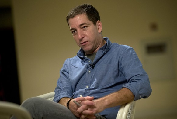 FILE - In this July 14, 2013 file photo, journalist Glenn Greenwald speaks during an interview with The Associated Press in Rio de Janeiro. Greenwald, the journalist most associated with the coverage  ...
