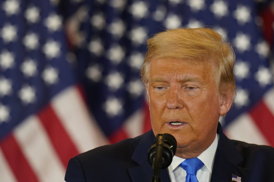 United States President Donald J. Trump makes a statement to the nation as his supporters look on in the East Room of the White House in Washington, DC on Election Night, Wednesday, November 4, 2020.  ...