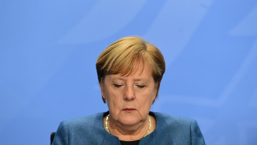 BERLIN, GERMANY - OCTOBER 28: German Chancellor, Angela Merkel attends a press conference after a video conference with German State Premiers about the current coronavirus situation, at the Chanceller ...