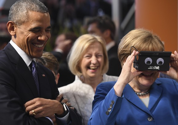HANOVER, GERMANY - APRIL 25: U.S. President Barack Obama (L) and German Chancellor Angela Merkel visit the ifm electronics stand at hall 9 at the Hannover Messe industrial trade fair on April 25, 2016 ...