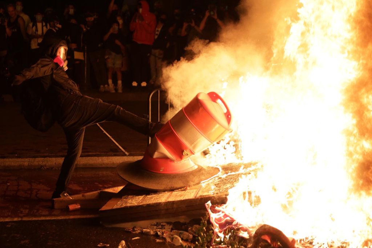 WASHINGTON, DC - MAY 31: Demonstrators set a fire during a protest near the White House on May 31, 2020 in Washington, DC. Minneapolis police officer Derek Chauvin was arrested for Floyd's death and i ...