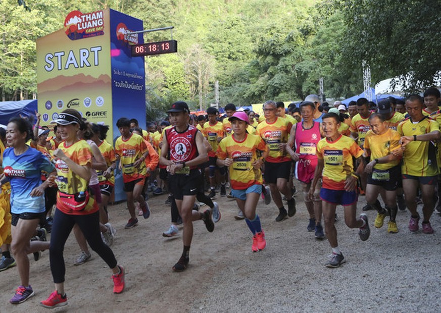 Participants start during a marathon and biking event in Mae Sai, Chiang Rai province, Thailand, Sunday, June 23, 2019. Around 4,000 took part in the event Sunday morning, organized by local authoriti ...